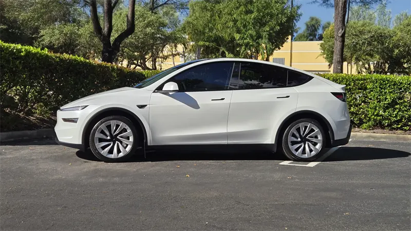 The white Model Y of this passport, side view